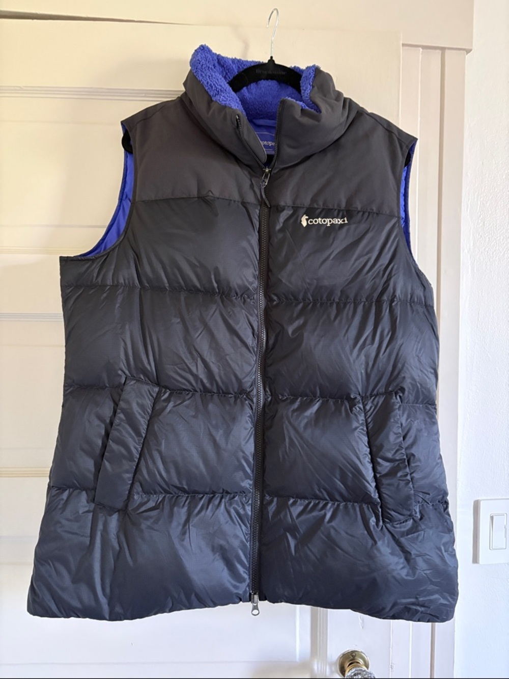 cotopaxi Black puffer vest with blue lining